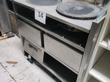 a kitchen with a stove and a sink in it