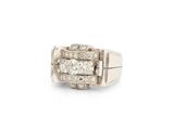 a close up of a diamond ring on a white background