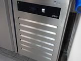 a stainless steel dishwasher in the corner of a kitchen