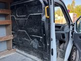the back of a van with the door open and the back of the van with the door open