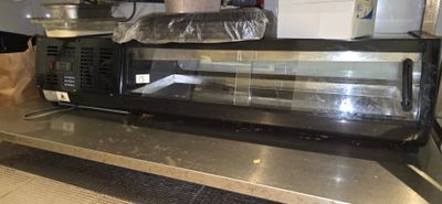 an image of a counter top display case in a restaurant