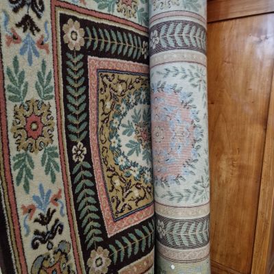 two rugs on the floor next to each other