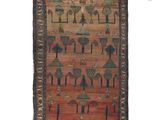 a brown and red rug with a pattern of trees on it