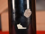a close up of a bottle of wine with a sticker on it