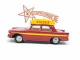 a red toy car with a sign on top of it