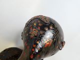 a statue of a bird that is sitting on top of a table