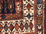 an image of a close up of a rug with a cat laying on it