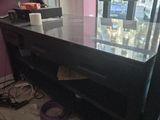 a desk with a computer on it in a room