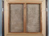a close up of a picture of a window with a wooden frame