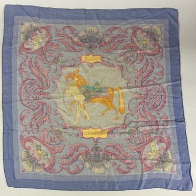 an image of a blue and pink scarf with a picture of a horse on it