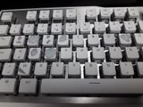 a close up of a computer keyboard on a desk