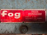 a red sign on the side of a blue machine