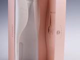 packaging for a pink toothbrush in a pink box