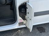 a white van with its door open and the door open