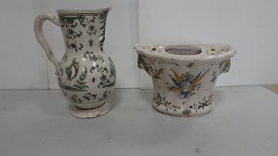 two vases sitting next to each other on a table