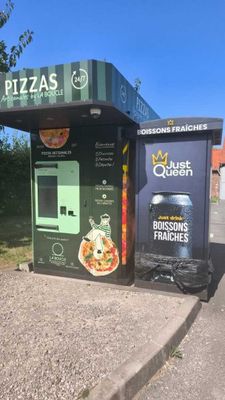 two vending machines that are on the side of the road
