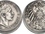 a close up of a silver coin with an eagle on it