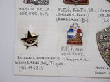a lot of badges on a piece of paper