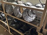 many pots and pans on the shelves in the warehouse