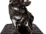bronze sculpture of a dog sitting on a marble base