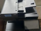 a printer that is sitting on top of a cabinet