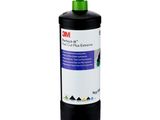 a bottle of black ink sitting on top of a white surface
