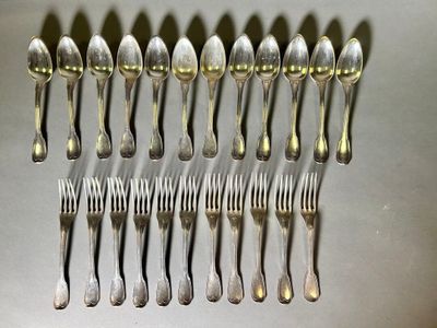 many spoons and forks arranged in a row on a table
