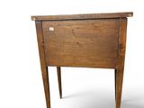 a small wooden table with a drawer on it