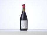 the bottle of wine is sitting on the table with a white background