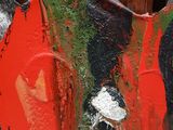 a red fire hydrant that has a hole in it