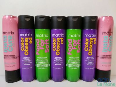 the bottles of matrix color care are lined up on the table