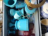 a box full of blue and white dishes and cups