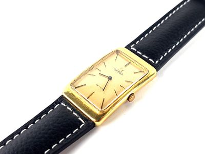 an image of a close up of a wrist watch on a white surface