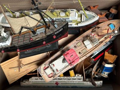 a box full of toy boats and other toys