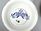 a white plate with a blue and white design on it