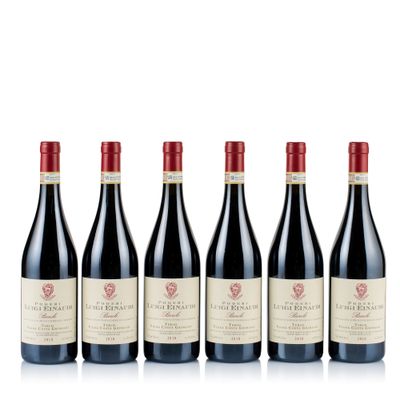 six bottles of red wine lined up in a row