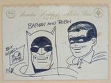 dessin de Batman et Robin sur une feuille de papier