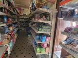 many shelves in the store with various items on them