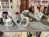 a lot of coffee cups sitting on a table