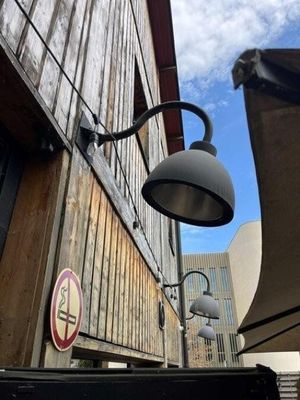 a street light that is on the side of a building