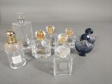 a lot of perfume bottles that are sitting on a table