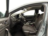 the interior of a car with the door open showing the driver ' s seat area