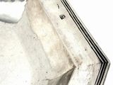 a silver plate with a black border around it