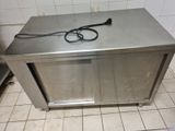 a metal counter with a pair of scissors on it