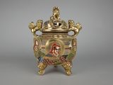 an image of a gold and enamel vase with a woman on it