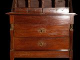 an old wooden desk with a drawer on top of it