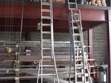 a ladder that is leaning against a wall in a garage