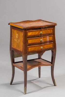 an image of a small wooden table with drawers and a shelf