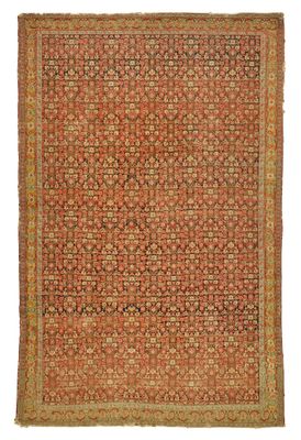 un tapis orange et vert orné d'un motif en médaillon