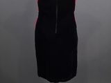 black and pink cocktail dress on a mannequin stand